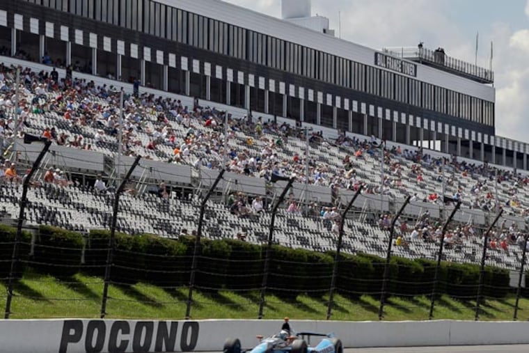 Alex Tagliani drives during a qualifying session for Sunday's Pocono IndyCar 400 auto race, Saturday, July 6, 2013, in Long Pond, Pa. (Mel Evans/AP)