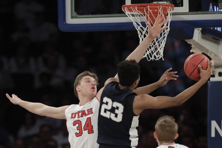 Penn State guard Josh Reaves (23) shoots next to Utah forward Jayce Johnson (34) in the first quarter of an NCAA college basketball game for the NIT championship Thursday, March 29, 2018, in New York. (AP Photo/Julie Jacobson)