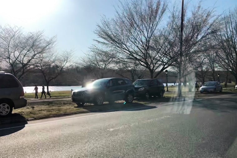 During the pandemic people have been parking illegally on the grass along Kelly Drive, as shown here on Sunday. The city says it will start cracking down this week.