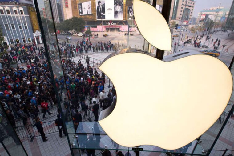 A long line outside an Apple store in Beijing in October. Demand for iPhones is weaker.