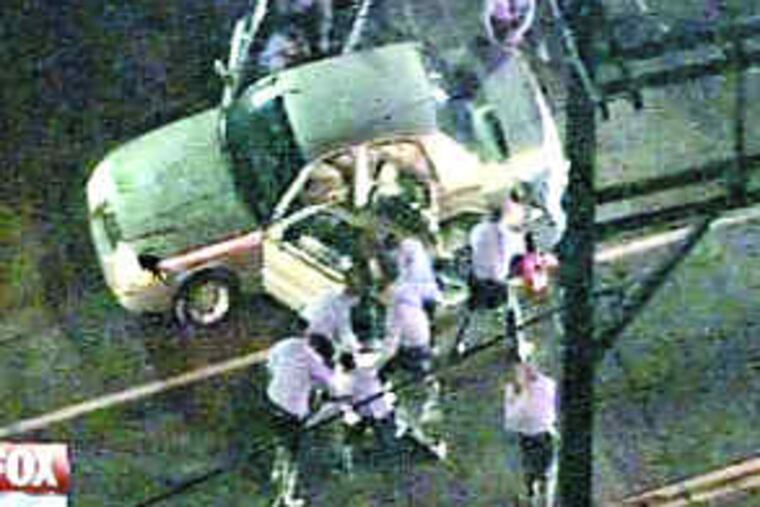The footage shot from a news helicopter on May 5, 2008, showed police dragging three men from a car and forcefully subduing them after shots were fired into a crowd in North Philadelphia. A jury on July 1 acquitted the three men of attempted-murder charges.