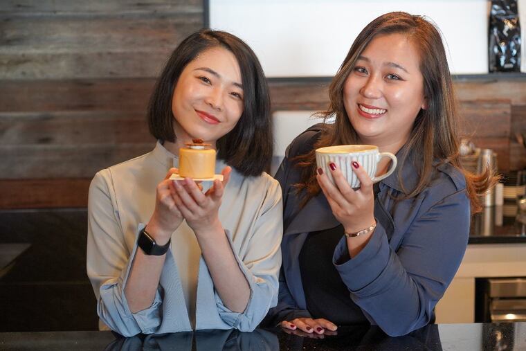 Trista Tang (left, with hazelnut mousse) and Sarah Qi (with a latte) at Cake & Joe in Pennsport.