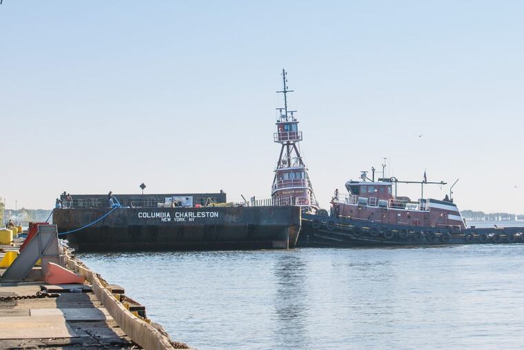 This barge at Penn Terminals in Eddystone will be loaded with shipping containers filled with food and water bound for Puerto Rico.