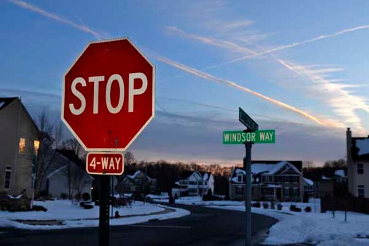 The sun sets in the Greenwich Crossing development in East Greenwich Twp. March 4, 2014. The area is attractive to buyers looking for more bang for the buck, relos for new close to Philadelphia and Wilmington on I-295 and builders wanting to build for both. ( TOM GRALISH / Staff Photographer )