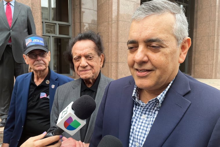 FILE - Former U.S. Rep. David Rivera speaks with media outside a federal court in Miami, Dec. 20, 2022. (AP Photo/Joshua Goodman, File)