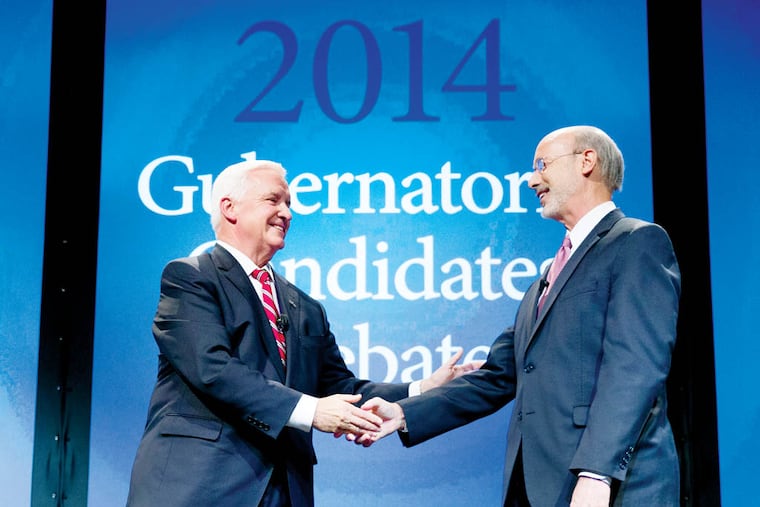 Republican Gov. Tom Corbett, left, and Democrat Tom Wolf shake hands at the end of a gubernatorial debate hosted by the Pennsylvania Chamber of Business and Industry, Monday, Sept. 22, 2014, in Hershey, Pa. (AP Photo/Matt Rourke)