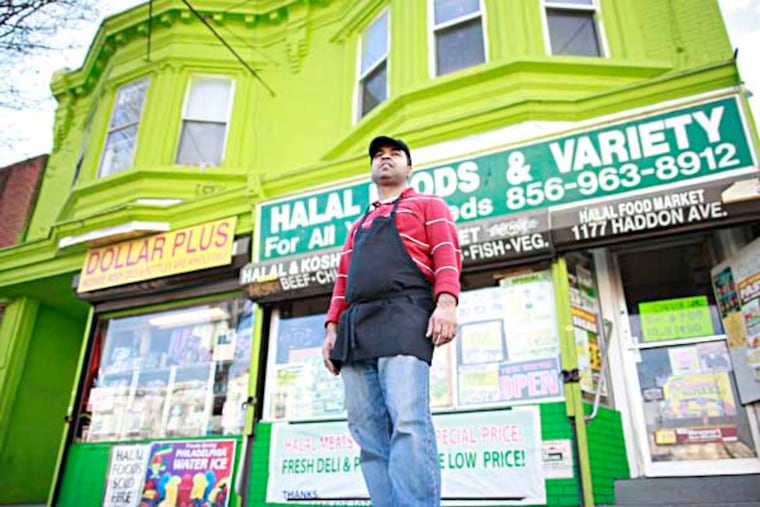 Mohammed Uddin, who owns Halal Meats & Grill on Haddon Avenue, said the new county force has cleared the sidewalk in front of his store of men who used to gather in groups and sometimes panhandle and drink, Friday December 27, 2013. ( DAVID SWANSON / Staff Photographer )