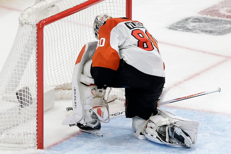 Flyers goaltender Dan Vladař reacts after allowing Pittsburgh's third goal, which came on a fluky bounce off the end boards.
