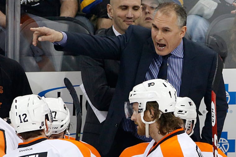 Craig Berube gives instructions during an NHL hockey game against the Pittsburgh Penguins in Pittsburgh, Saturday, April 12, 2014. (Gene J. Puskar/AP)