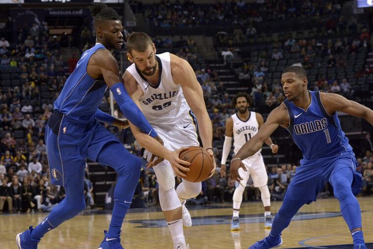 Nerlens Noel is an active defender, here slowing down Memphis’ Marc Gasol en route to the basket.