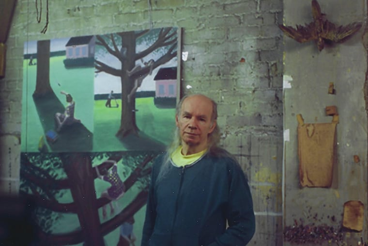 A photo provided by the Moriarty family shows artist Jerry Moriarty with some of his paintings in his loft in Manhattan in 2010. A self-described “paintoonist,” Moriarty, who created cartoons with spare dialogue that reminded his admirers of poetry or Samuel Beckett’s plays, died on March 25, 2026, at his home in Binghamton, N.Y. He was 88.