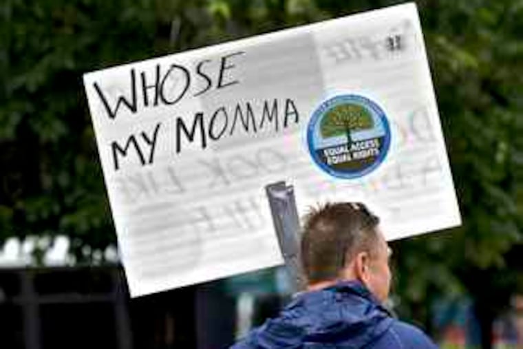Protesters near Independence Hall yesterday objected to laws denying adoptees access to original birth certificates. "There's no sane reason for us not to have the information," one said. B7.