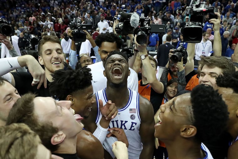 Duke's Zion Williamson (center) celebrates with his teammates after the Blue Devils beat Florida State in the ACC Tournament title game on Saturday.