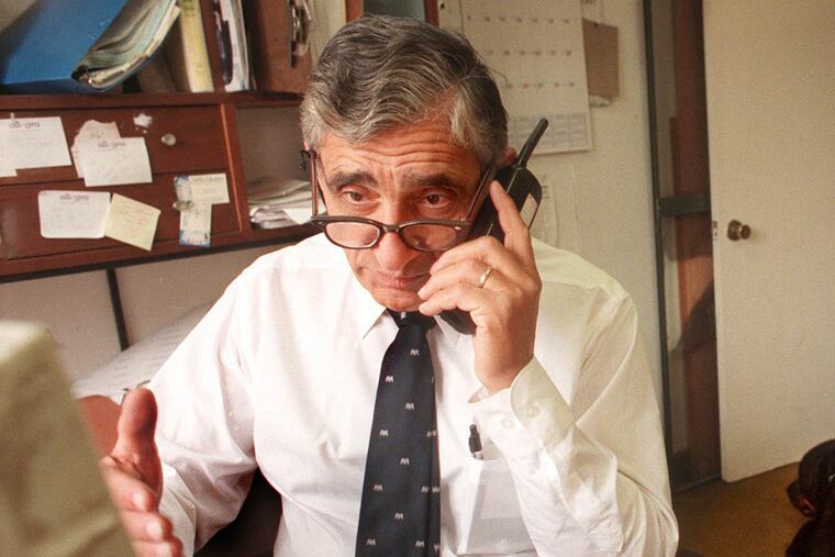 Jimmy Tayoun works on the Public Record at his South Philadelphia home in April 2000. Photo by April Saul