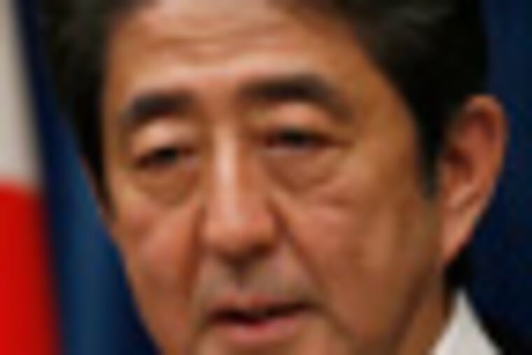 Japan's new Prime Minister Shinzo Abe speaks during his first press conference at the prime minister's official residence in Tokyo Wednesday, Dec. 26, 2012. Old-guard veteran Abe was voted back into office as prime minister Wednesday and immediately named a new Cabinet, ending three years of liberal administrations and restoring power to his conservative, pro-big-business party that has run Japan for most of the post-World War II era. (AP Photo/Shizuo Kambayashi)