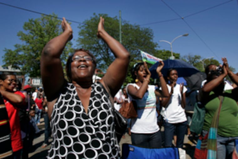 Tina Harrison cheers for a singer at the festival. Many musicians performed, including Chaka Khan, the Grammy-winning singer. The event blocked Baltimore Avenue from 49th to 51st Streets for seven hours.