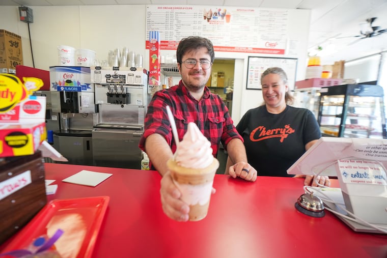 Miles Smith holds a gelati with cold brew water ice and strawberry ice cream, with his mother, Lisa Mohollen, at Cherry's Ice Cream & Water Ice, in Cherry Hill, N.J., April 21, 2026.