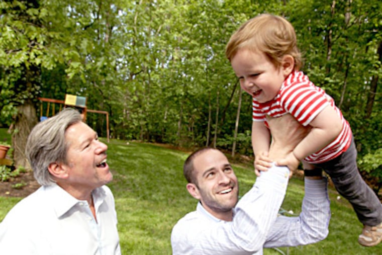 Reform Rabbi Jerry David (left) of Temple Emanuel in Cherry Hill and his son, Reform Rabbi Ben David of Temple Adath Emanu-El in Mount Laurel play with Ben's son, Elijah, 2. CHARLES FOX / Staff Photographer