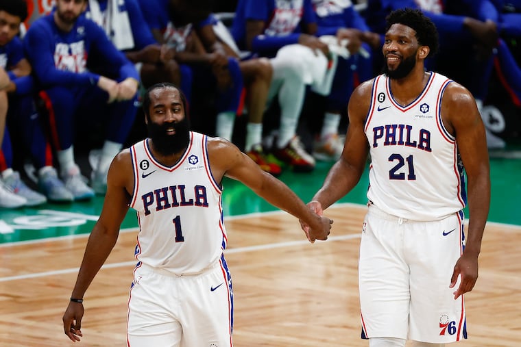 Sixers center Joel Embiid celebrates in the fourth quarter with teammate guard James Harden against the Boston Celtics in Game 5 of the Eastern Conference semifinal playoffs at TD Garden in Boston on Tuesday, May 9, 2023.