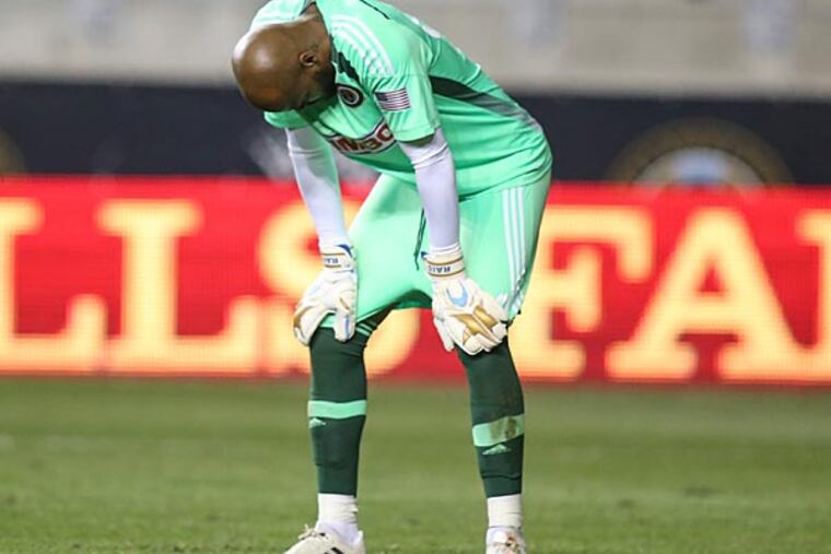 Union goalkeeper Rais Mbolhi (92) reacts after the goal by Chicago Fire forward Robert Earnshaw (88). (Steven M. Falk/Staff Photographer)