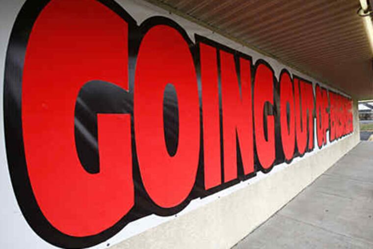 A going-out-of-business sign on the Oskar Huber furniture store in Southampton, Bucks County. The retailer hired a company that specializes in liquidation sales to sell off its inventory. (Eric Mencher / Staff Photographer)
