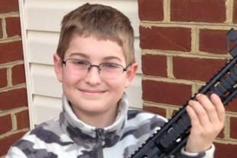 Shawn Moore's son, 11, posing with his birthday present. (Facebook photo, provided by family's attorney.