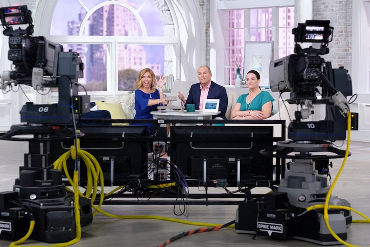 QVC Program Host Jennifer Coffey, left, on air guest JAI Jewelry Scott Grimes, center, and model Adrienne Morella at QVC's headquarter's in West Chester.