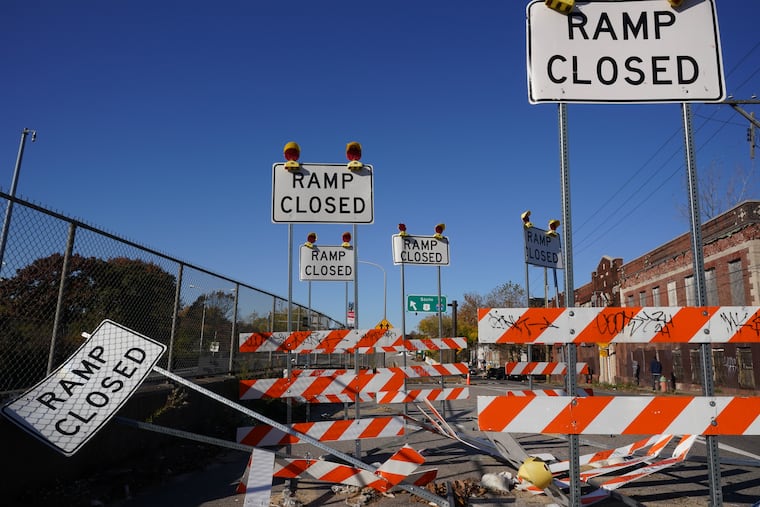 Construction signs positioned in front of an on-ramp near 16th Street for the Roosevelt Boulevard Extension.