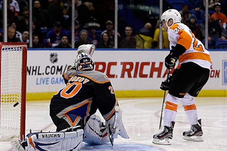 Sometimes the best message isn't spoken, but shown. Claude Giroux's on-ice example could not be confused Monday afternoon. (Seth Wenig/AP)
