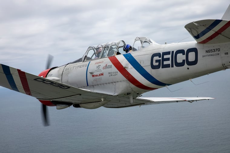 The GEICO Skytypers Air Show Team piloted by Steve Salmirs over the Atlantic ocean in full view of vacationers in Atlantic City on Monday, August 16, 2021.