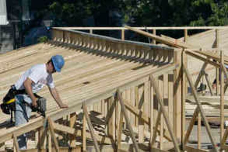 Workers frame a new commercial building in Warensville Heights, Ohio. Construction spending in September posted an increase.
