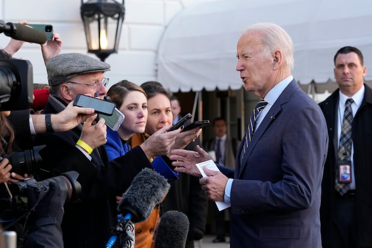 President Joe Biden talks with reporters before he and first lady Jill Biden board Marine One on the South Lawn of the White House in Washington, Wednesday, Jan. 11, 2023.