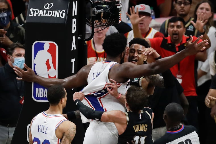 Sixers center Joel Embiid and Atlanta Hawks forward John Collins get into a scuffle during the fourth quarter in Game 6 of the NBA Eastern Conference semifinals on Friday, June 18, 2021 in Atlanta.