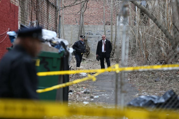 DAVID MAIALETTI / STAFF PHOTOGRAPHER A man questioned in the burial of a woman's body Tuesday in a Frankford yard has a violent past, police sources said yesterday.
