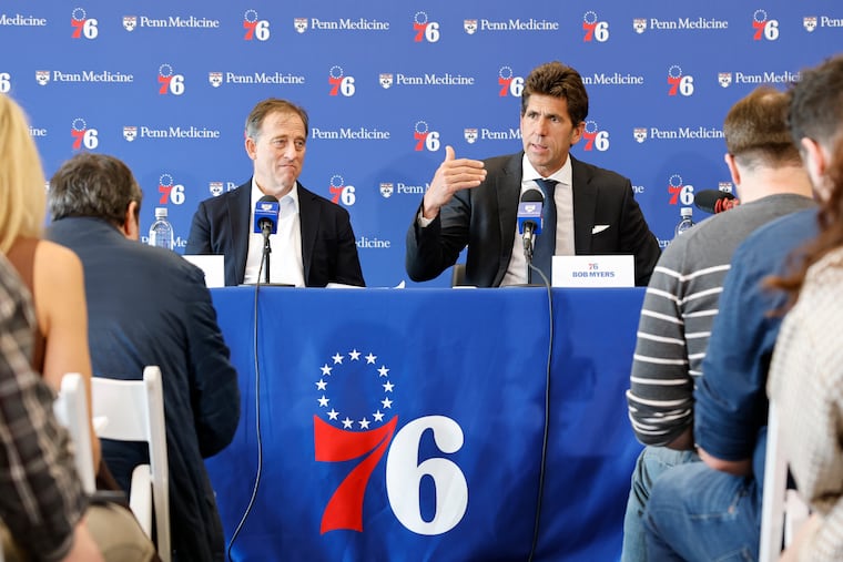 Josh Harris (left) and Bob Myers address what's ahead at their end-of-season news conference on May 14.