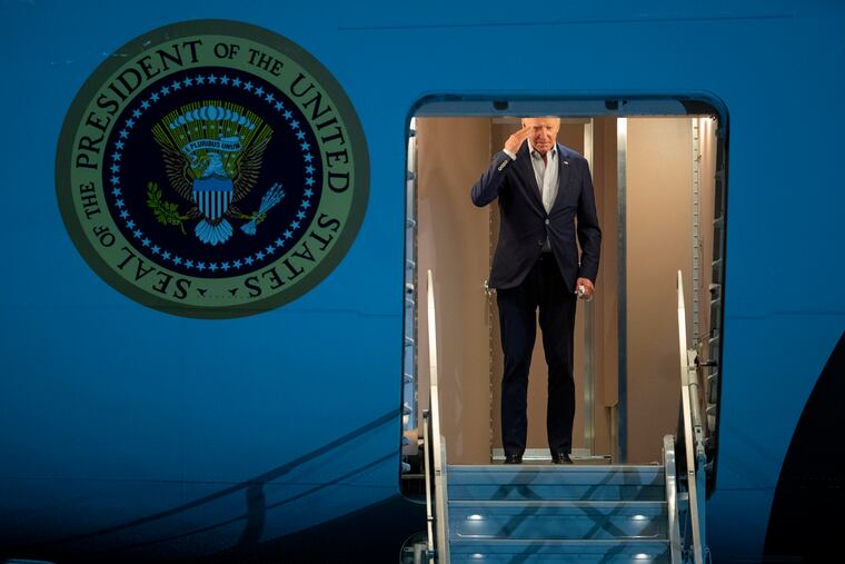 President Joe Biden returns a salute as he boards Air Force One for a trip to Israel and Saudi Arabia, Tuesday, July 12, 2022, at Andrews Air Force Base, Md.