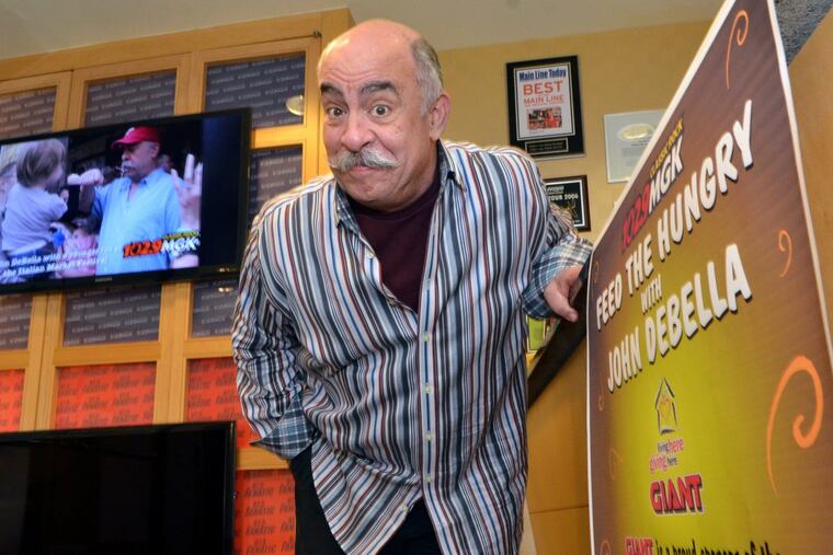 WMGK Radio Host John DeBella is seen next to a poster for his annual Turkey Drop event at the studio in Bala Cynwyd on Friday November 9, 2012.