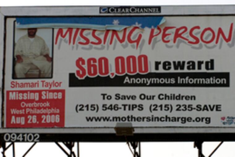 A billboard at 52nd and Walnut streets in West Philly offers a reward for information on Shamari Taylor, son of state Rep. John Myers.