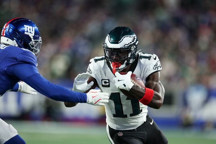 Eagles wide receiver A.J. Brown tries to fight off New York Giants cornerback Paulson Adebo in the second quarter of last week's loss at MetLife Stadium.