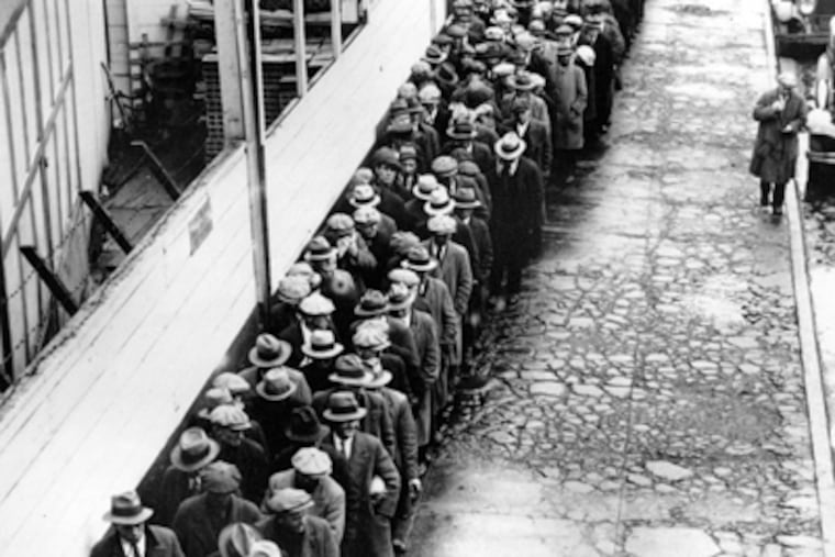 Jobless and homeless men in New York stand in line for a free meal during the Great Depression. (Associated Press)