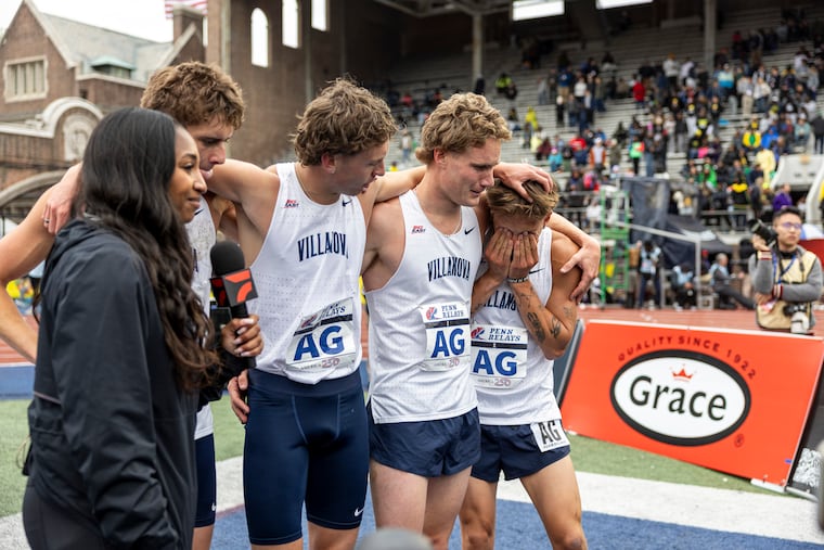 Villanova’s Marco Langon (right) tears up as he and his teammates win the college men's 4xMile championship at the Penn Relays on Saturday.