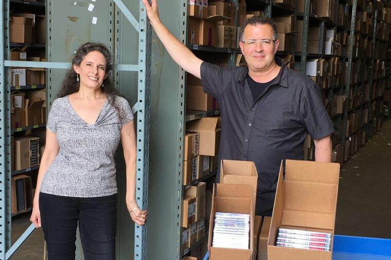 Towering music: Relocating MVD Entertainment from Oaks to larger quarters in Pottstown was "a bear" for the family run company, said CFO Eve Edwards and COO Ed Seaman. The 30,000 square foot warehouse is crammed with multiples of 40,000 titles (almost a million pieces in all) from 300 labels.