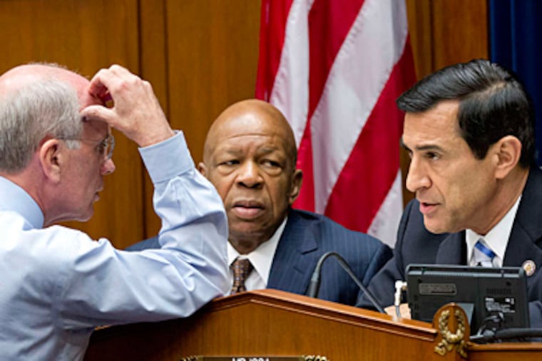 During a House oversight committee hearing, Reps. (from left) Peter Welch, Elijah E. Cummings, and Darrell Issa confer. (AP)