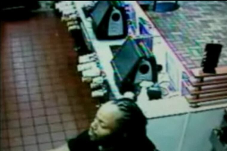 Image from video of suspect who climbed into a New Jersey McDonald's, demanding his Filet-o-Fish.