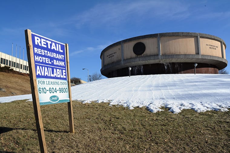 A "For Lease" sign sits in front of the old Franklin Mint Museum and other buildings in Middletown Township, Delaware County Feb. 28, 2014. Developers put forth a controversial plan several years ago, which generated considerable opposition from local residents, but plans have since been scaled back. (Clem Murray / Staff Photographer)