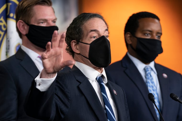 Lead House impeachment manager Rep. Jamie Raskin, D-Md., with impeachment managers Rep. Eric Swalwell, D-Calif., and Rep. Joe Neguse, D-Colo., right, speaks to members of the media during a news conference on Capitol Hill in Washington on Saturday, after the U.S. Senate voted to acquit former President Donald Trump, ending the impeachment trial.