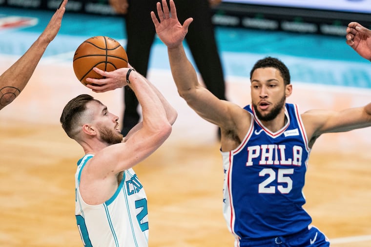 Ben Simmons guards against Charlotte Hornets forward Gordon Hayward, left, during the second half.