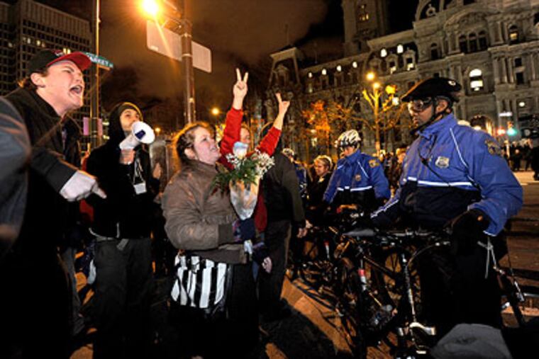 Occupy Philadelphia protesters are blocked by police officers from returning to Dilworth Plaza. (April Saul / Staff Photographer)