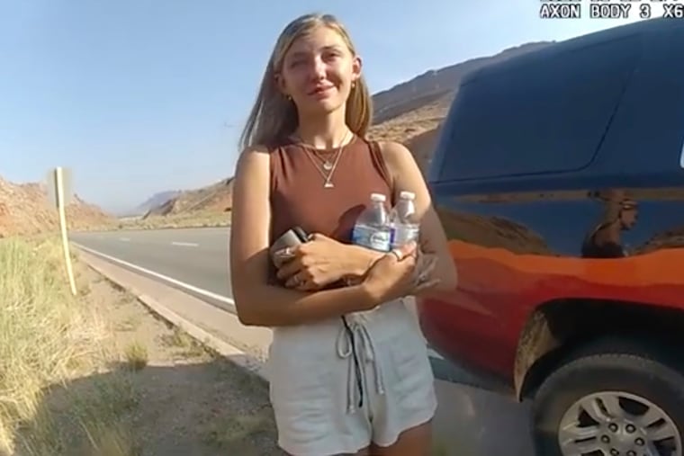 Gabby Petito talking to a police officer after police pulled over the van she was traveling in with her boyfriend, Brian Laundrie, near the entrance to Arches National Park on Aug. 12.