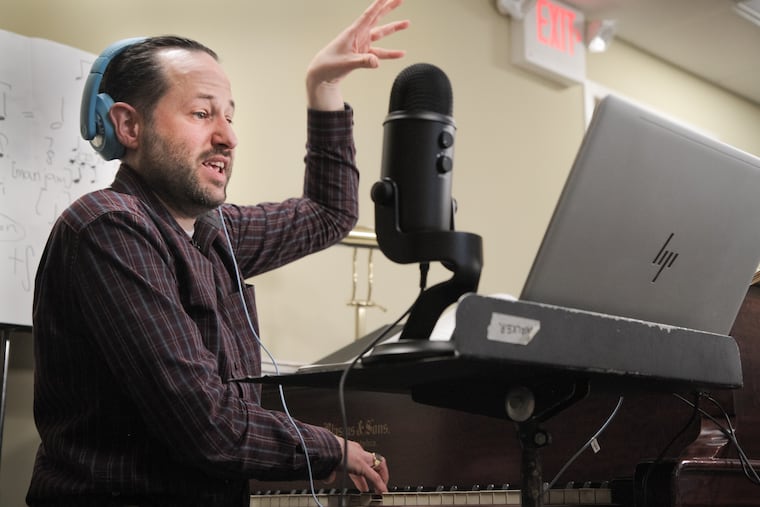 Jeffrey Smith, artistic director and conductor of the Philadelphia Boys Choir and Chorale, leads a virtual rehearsal with dozens of young choir members last week.